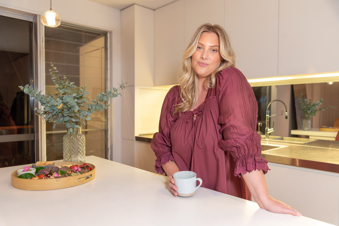 Woman wearing Barbara cotton long-sleeve nightgown in Burgundy, sizes AU 4-34, soft and comfortable for sleep