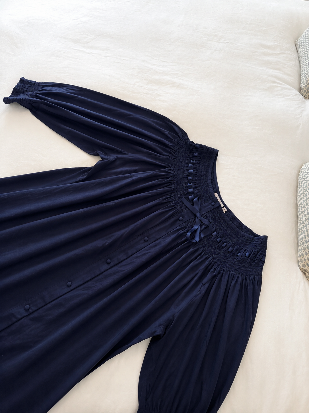 Harriet navy long sleeve cotton nightgown laid flat showing its full shape and sleeves.
