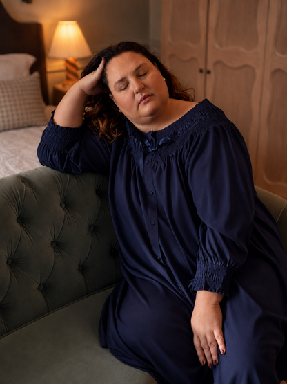 Harriet navy long sleeve cotton nightgown styled in a softly lit bedroom.